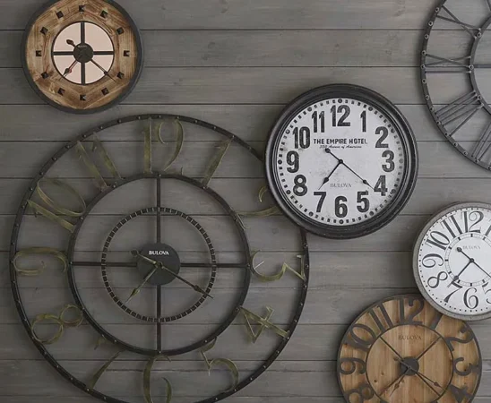Wall with assorted vintage clocks displayed decoratively.