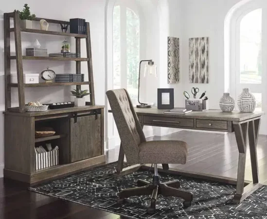 Modern home office with desk and bookshelf.