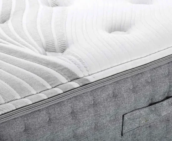 Close-up of textured white mattress surface