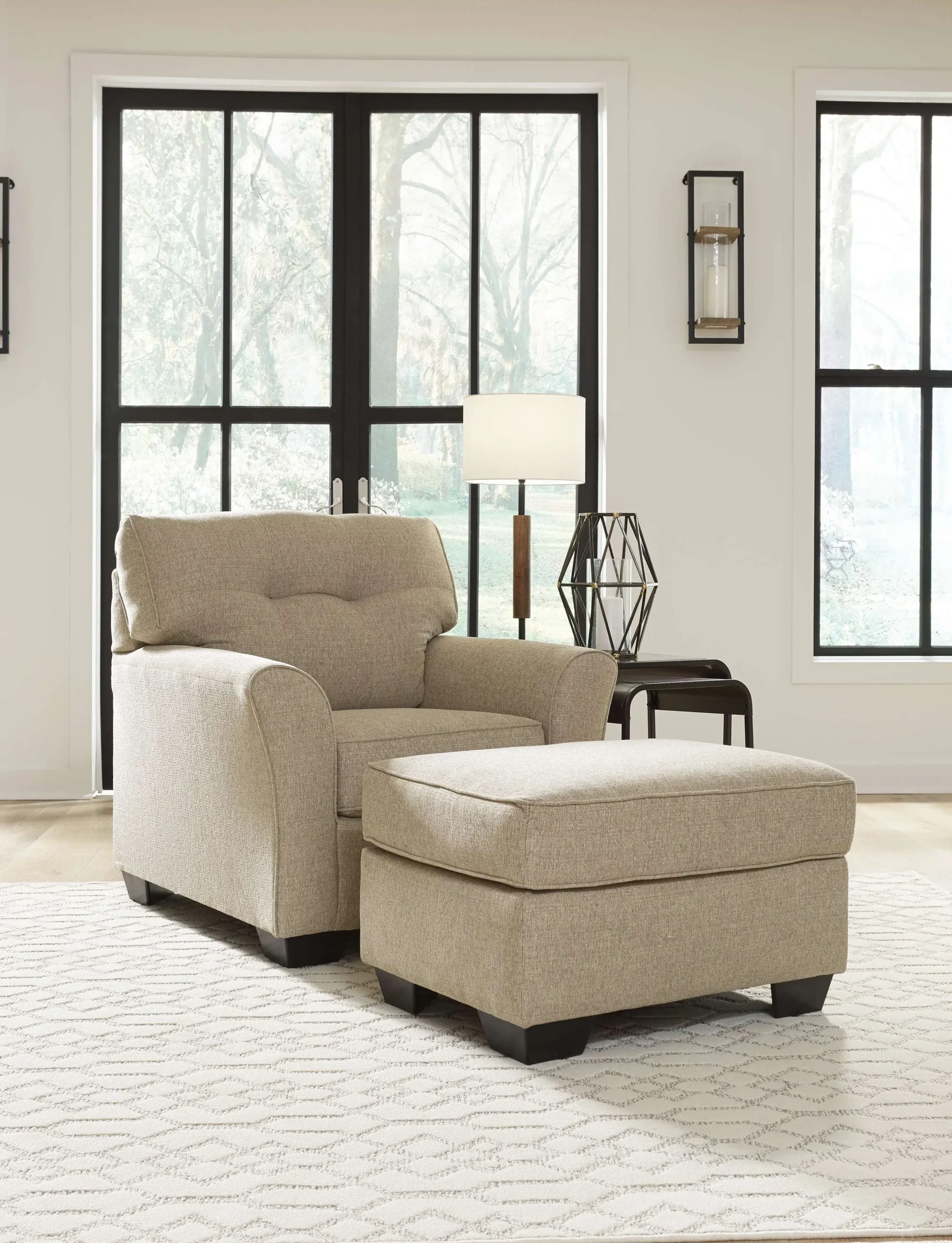Beige armchair and ottoman in living room