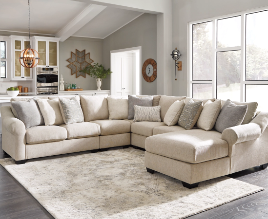 Modern beige sectional sofa in bright living room.